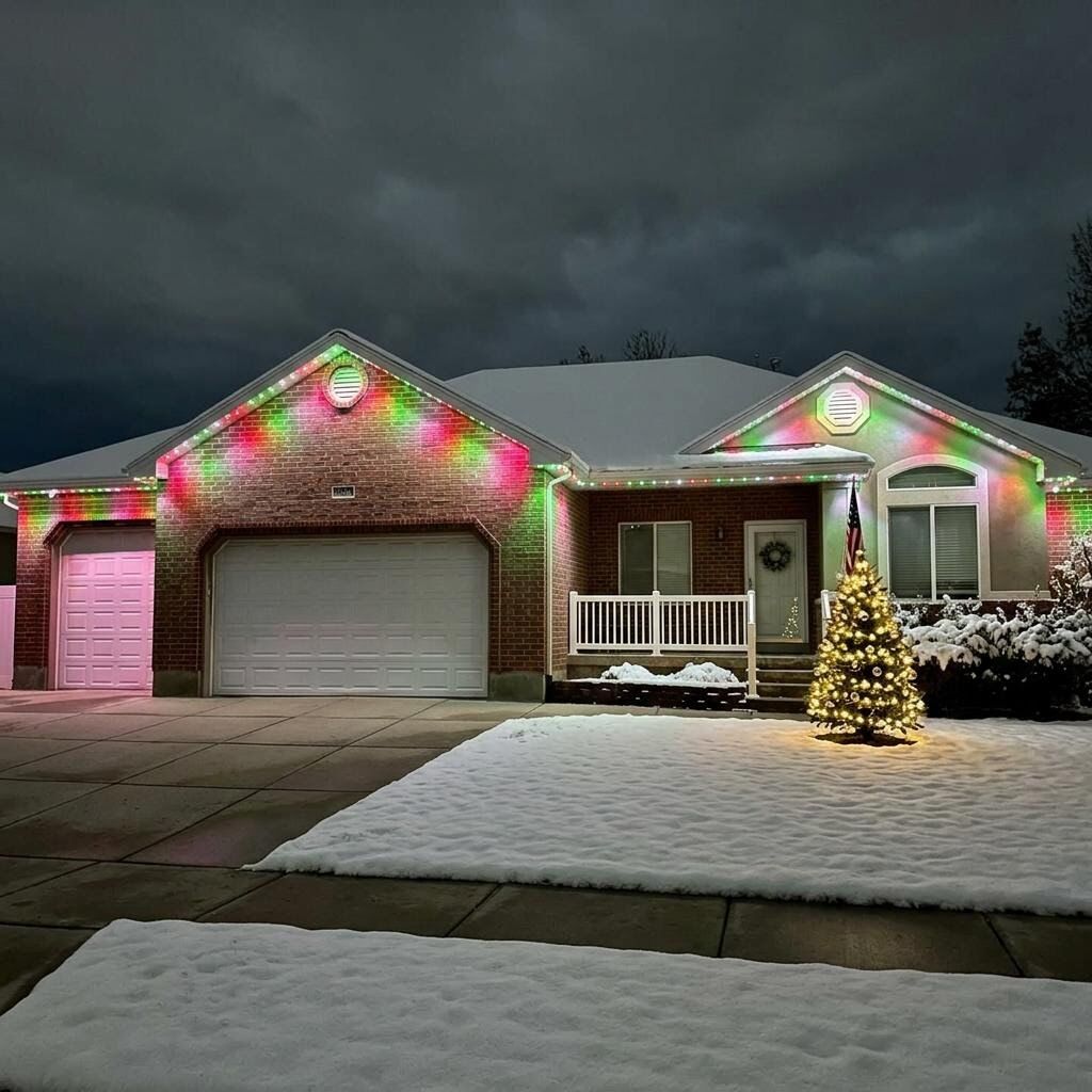 Utah home at night with CHIPR LUX Christmas lighting roofline lighting in Red & Green